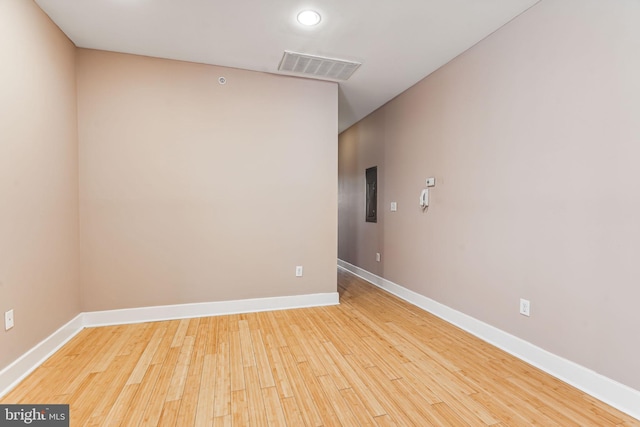 spare room featuring light hardwood / wood-style flooring