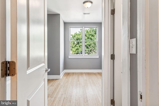 hall with light wood-type flooring