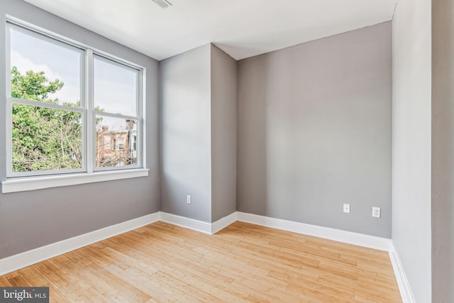 spare room with light wood-type flooring