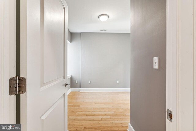 hall with light wood-type flooring