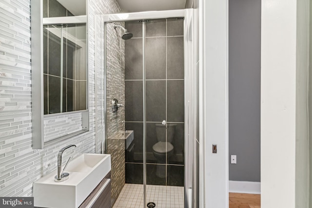 bathroom with a shower with door