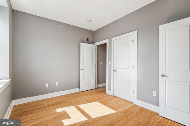 unfurnished bedroom with light hardwood / wood-style floors