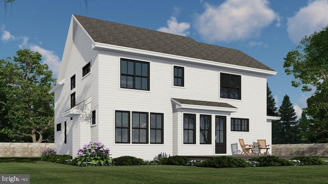 view of front of house featuring a front lawn, a shingled roof, and fence