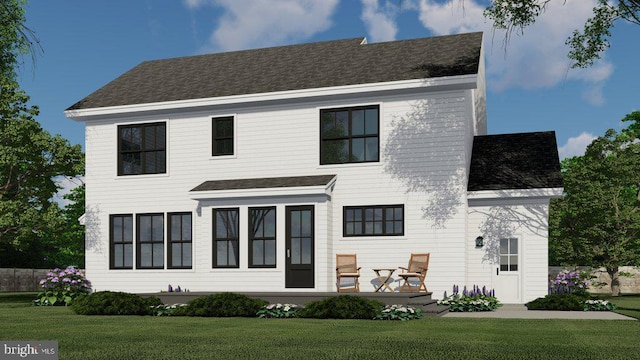 view of front facade featuring a shingled roof and a front yard