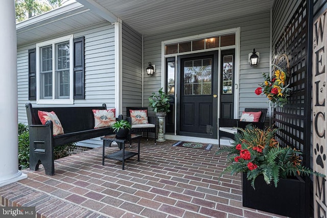 doorway to property featuring covered porch