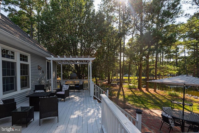 wooden deck with an outdoor living space and a pergola