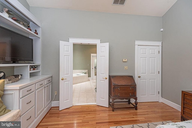 bedroom with light wood-type flooring