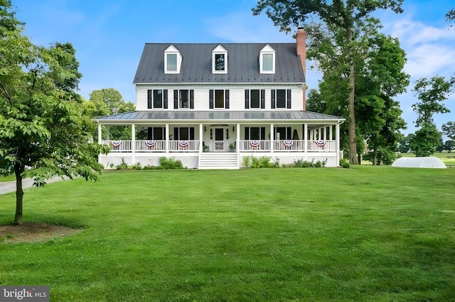 view of front facade with a front yard and a porch