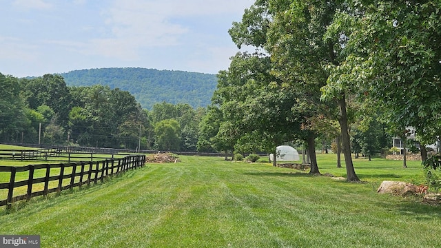 exterior space featuring a forest view