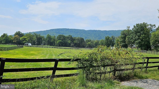 mountain view featuring a rural view and a wooded view