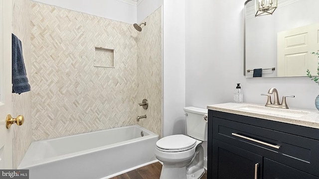 full bath featuring shower / bathing tub combination, vanity, toilet, and wood finished floors