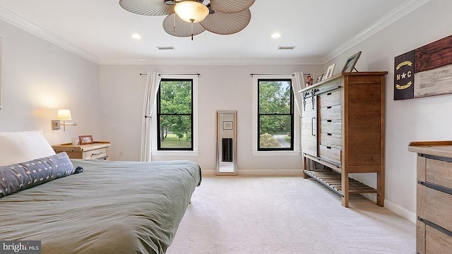 bedroom with baseboards, crown molding, visible vents, and light colored carpet