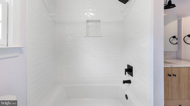 bathroom featuring shower / bathing tub combination and vanity