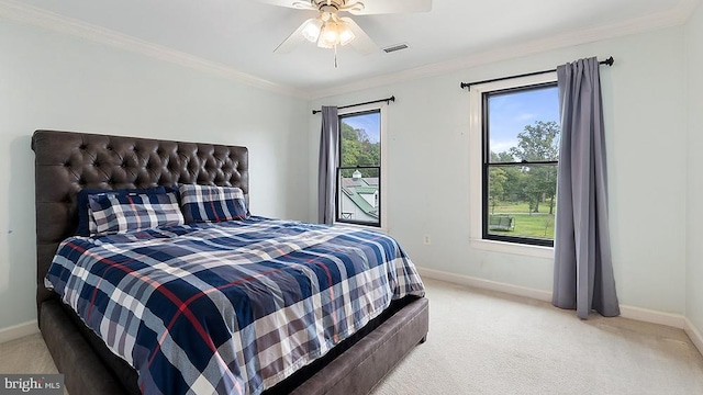 bedroom featuring light carpet, baseboards, visible vents, and ornamental molding