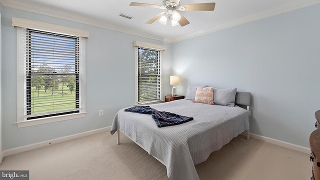 bedroom featuring ornamental molding, carpet, visible vents, and baseboards