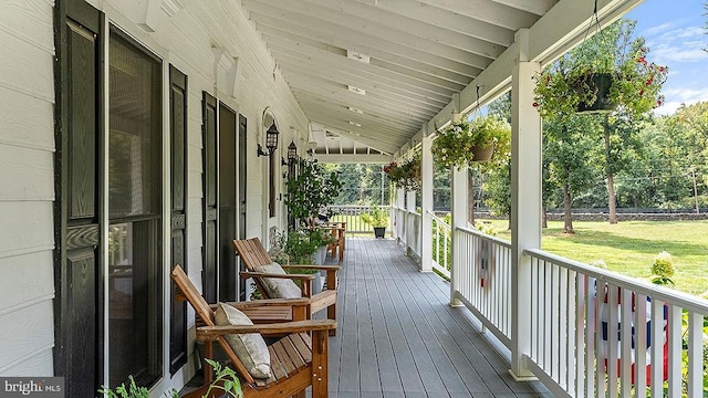 wooden deck featuring covered porch