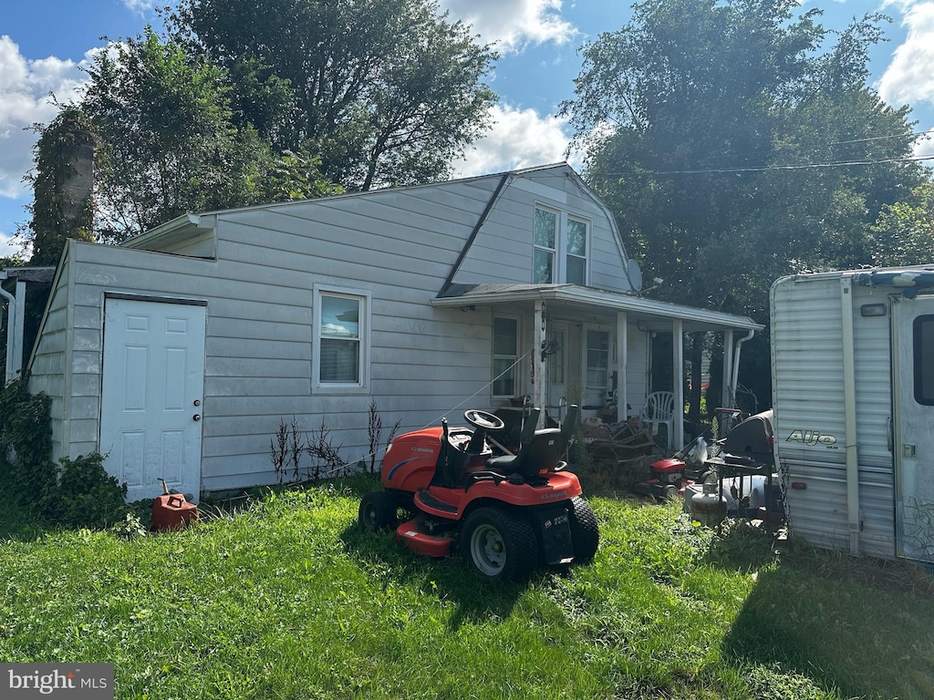 back of house with a yard