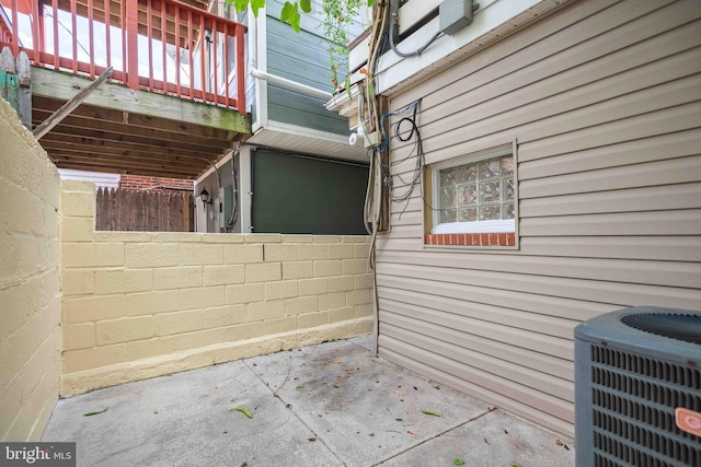 view of patio / terrace with central AC and fence