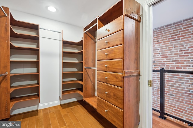 walk in closet featuring light wood-style flooring