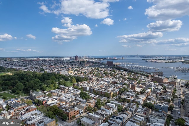 birds eye view of property with a view of city and a water view