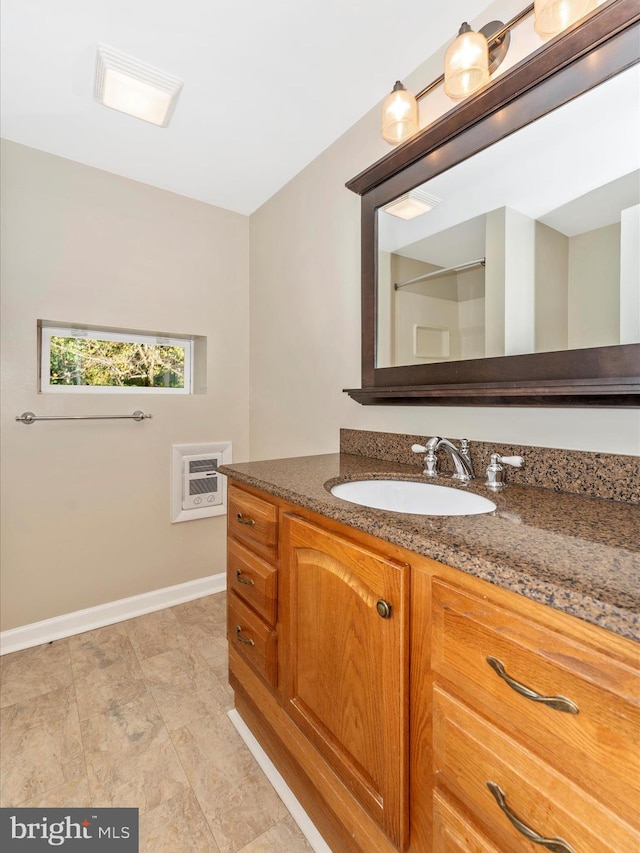 bathroom with vanity and heating unit