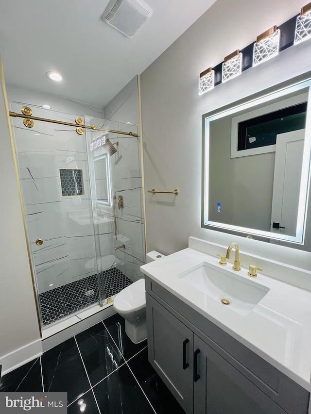 bathroom featuring walk in shower, vanity, and toilet