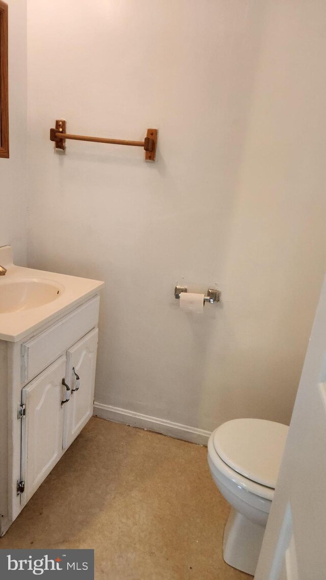 bathroom with toilet and vanity