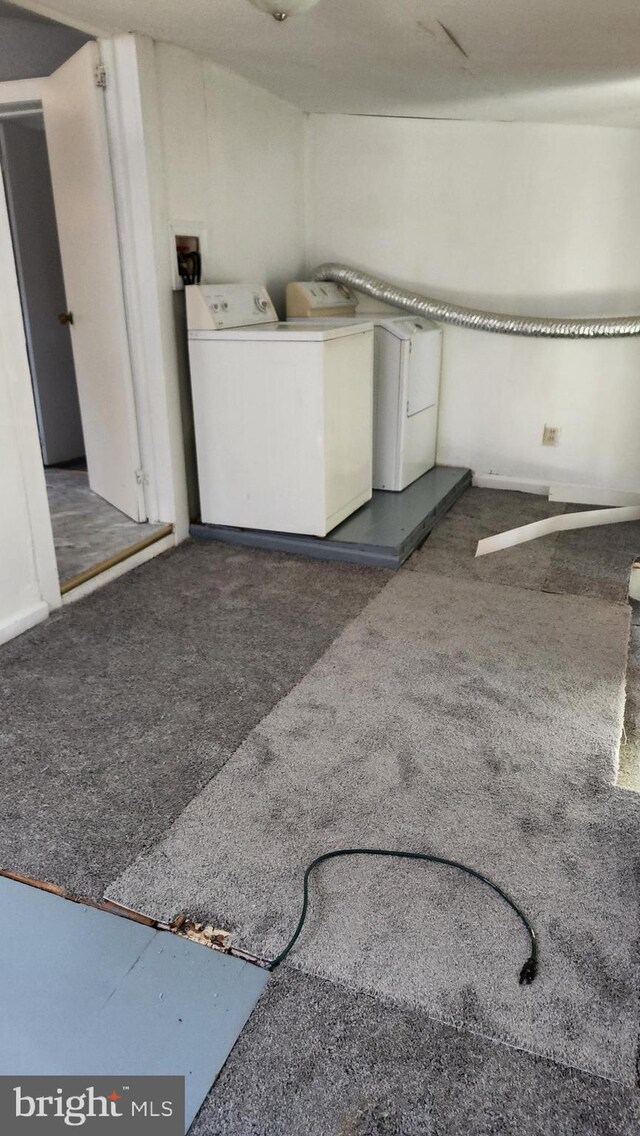 laundry room featuring washing machine and clothes dryer