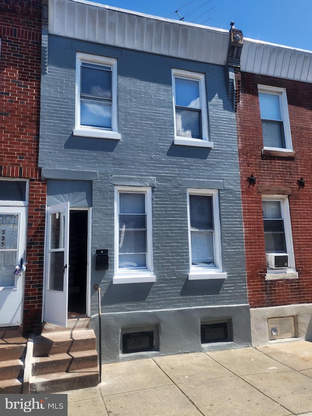 exterior space featuring brick siding