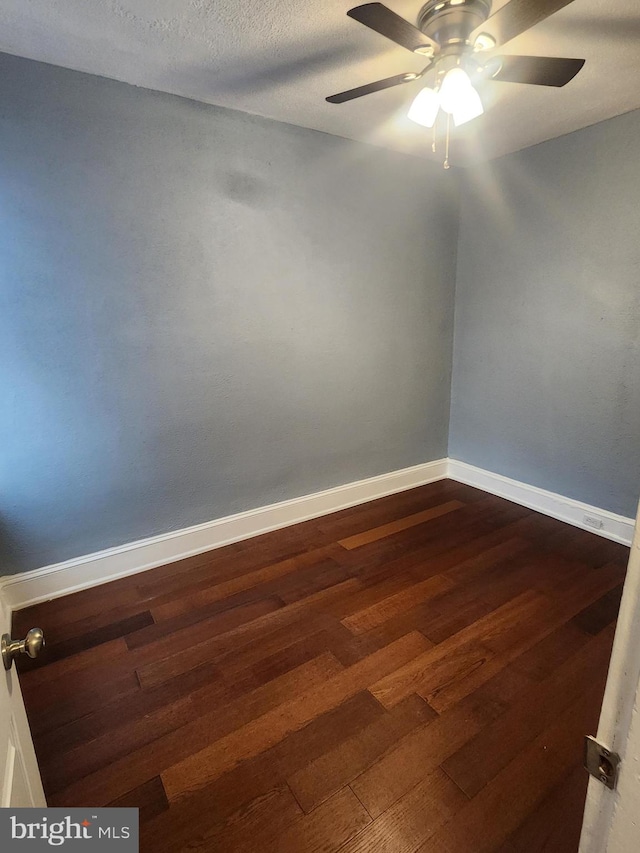 empty room featuring a textured ceiling, ceiling fan, and hardwood / wood-style flooring