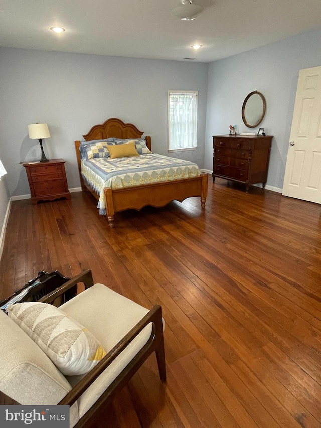 bedroom with wood-type flooring