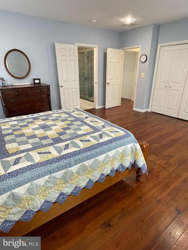 bedroom featuring dark hardwood / wood-style flooring and a closet