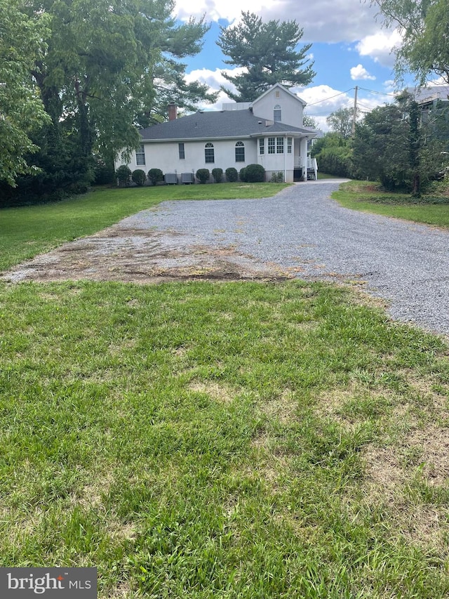 exterior space featuring a front lawn