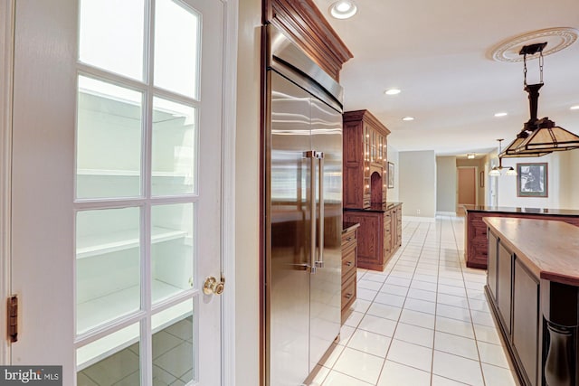 hall with light tile patterned floors and recessed lighting