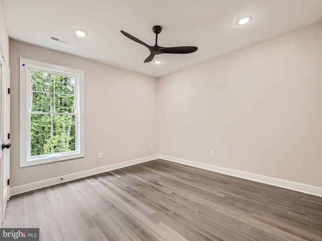 unfurnished room featuring hardwood / wood-style floors and ceiling fan