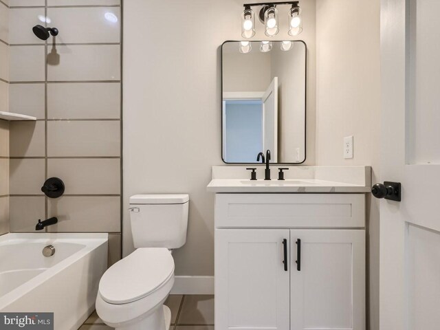 bathroom with tile patterned floors, toilet, and vanity