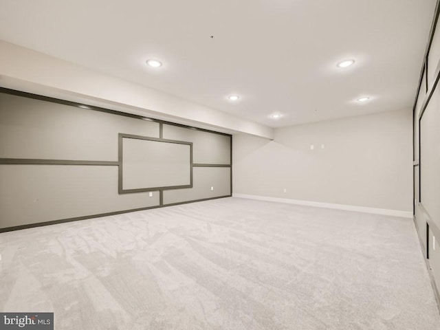 interior space with light carpet, baseboards, and recessed lighting