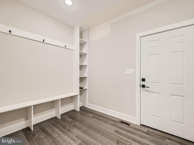 mudroom featuring dark wood-type flooring, recessed lighting, visible vents, and baseboards