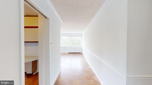 hallway featuring crown molding