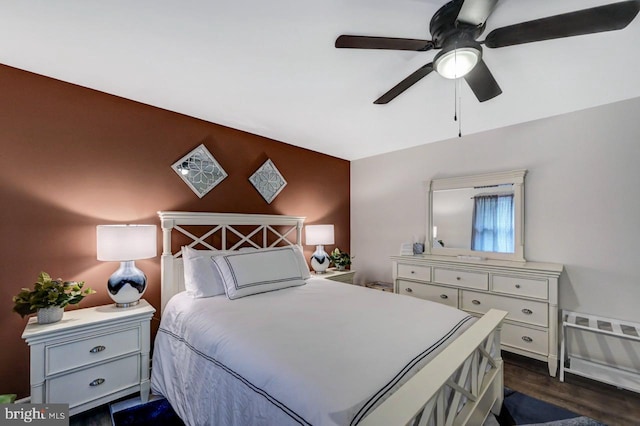 bedroom featuring ceiling fan and dark hardwood / wood-style floors