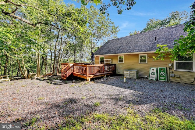 rear view of house with a deck