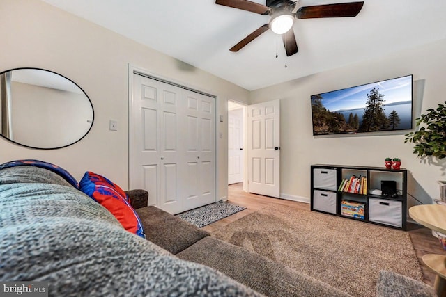 living room featuring light wood-type flooring and ceiling fan