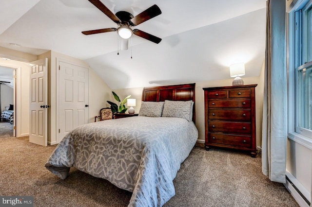 carpeted bedroom featuring ceiling fan and vaulted ceiling