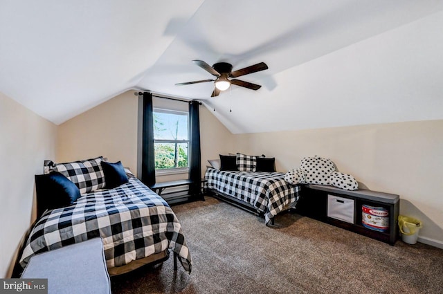 bedroom with ceiling fan, carpet floors, and lofted ceiling