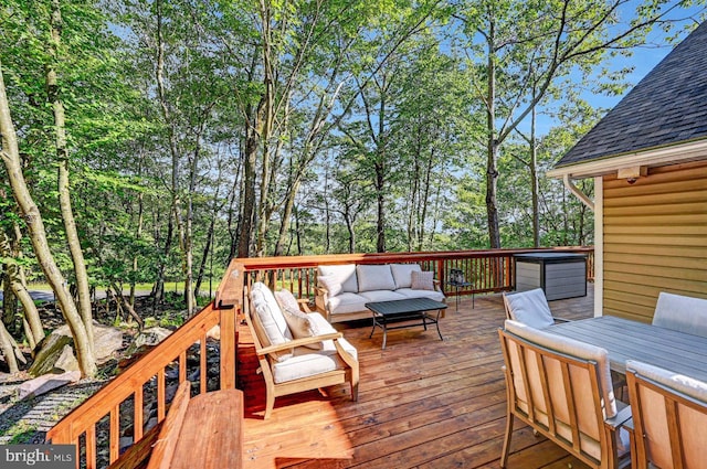 wooden terrace with outdoor lounge area