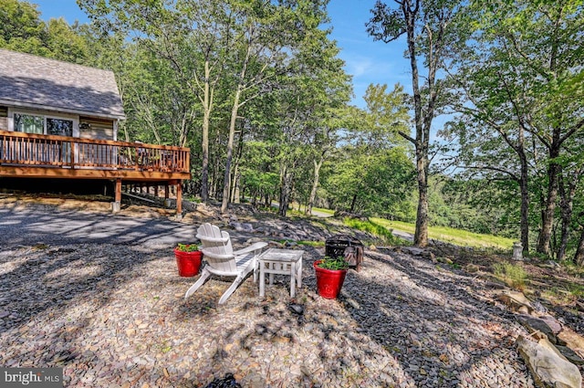 view of yard with a wooden deck