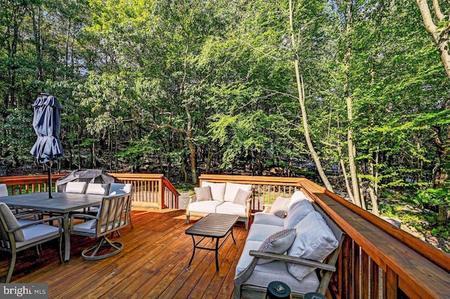 wooden terrace featuring an outdoor hangout area