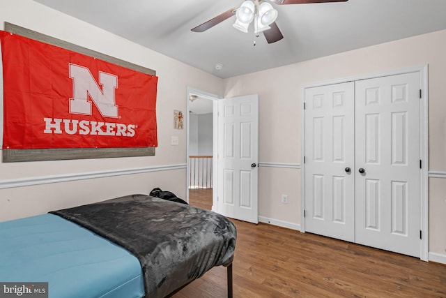 bedroom featuring a closet, ceiling fan, and wood-type flooring