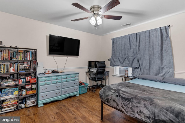 bedroom with ceiling fan, dark wood-type flooring, and cooling unit