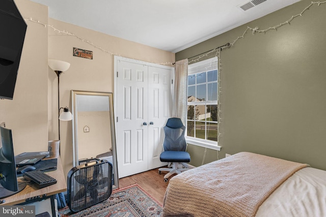 bedroom featuring a closet and hardwood / wood-style flooring